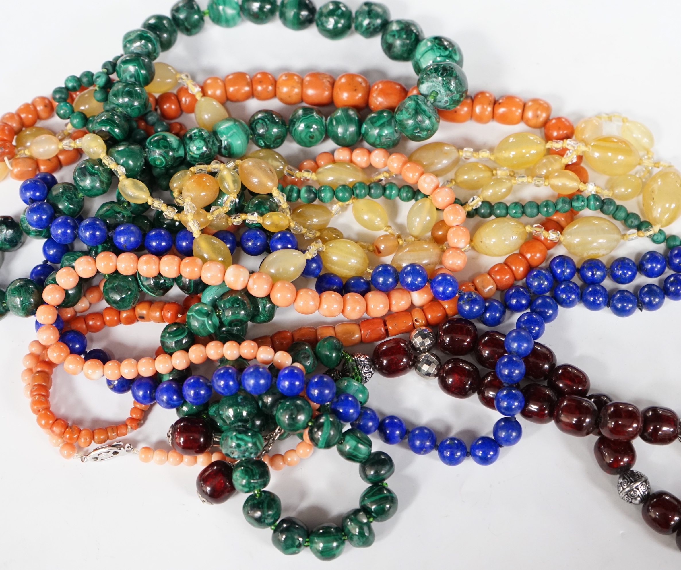 A quantity of assorted jewellery including costume, necklaces including amber, malachite, lapis lazuli and banded agate.